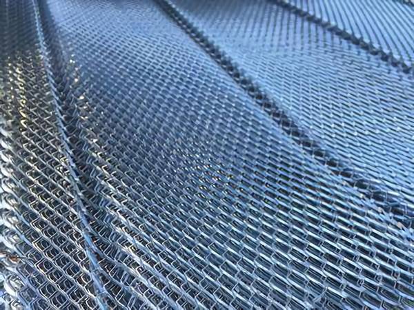 The picture of diamond metal lath with V grooves, several sheets are overlapped together.